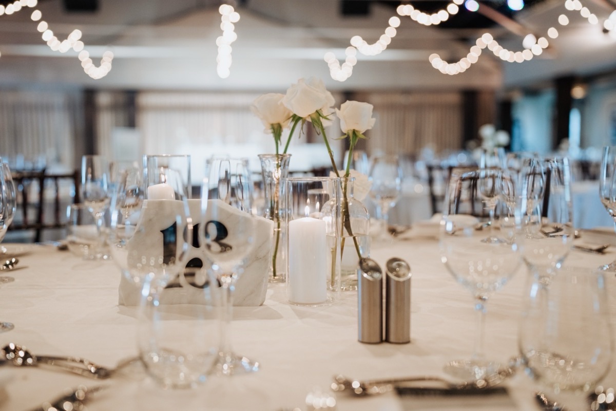 Reception florals in soft candlelight